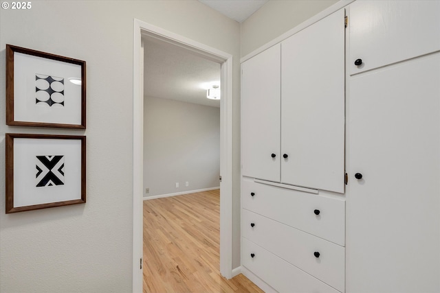 corridor featuring light hardwood / wood-style flooring