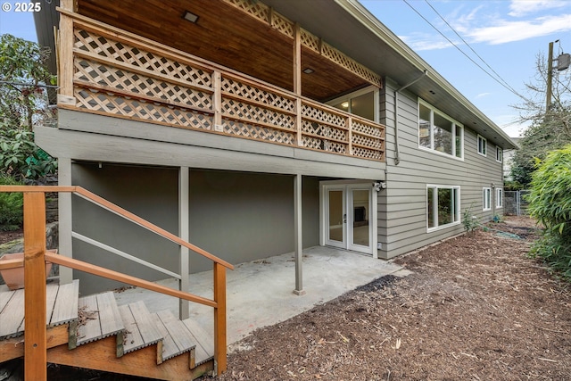 view of home's exterior with a balcony and a patio area