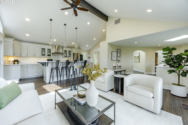 32518 Dillard Rd, Eugene, OR 97405 - living area with wood finished floors, beamed ceiling, recessed lighting, arched walkways, and a ceiling fan