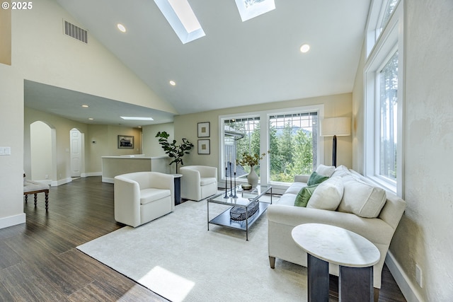 32518 Dillard Rd, Eugene, OR 97405 - living area with arched walkways, recessed lighting, wood finished floors, high vaulted ceiling, and a skylight