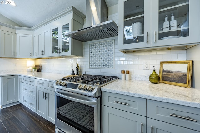 32518 Dillard Rd, Eugene, OR 97405 - kitchen featuring gas range, wall chimney exhaust hood, dark wood-style floors, light stone countertops, and backsplash
