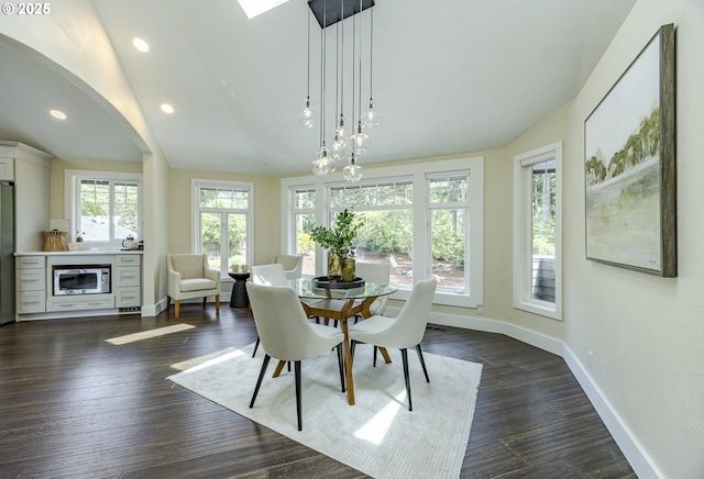 32518 Dillard Rd, Eugene, OR 97405 - dining room featuring lofted ceiling, arched walkways, dark wood-type flooring, and recessed lighting