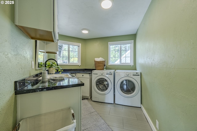 32518 Dillard Rd, Eugene, OR 97405 - laundry room with washer and clothes dryer, healthy amount of natural light, a textured wall, and light tile patterned floors
