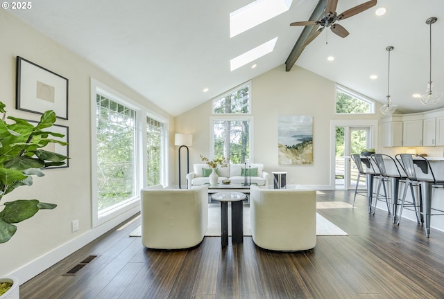 32518 Dillard Rd, Eugene, OR 97405 - dining room featuring beam ceiling, dark wood finished floors, ceiling fan, a skylight, and high vaulted ceiling