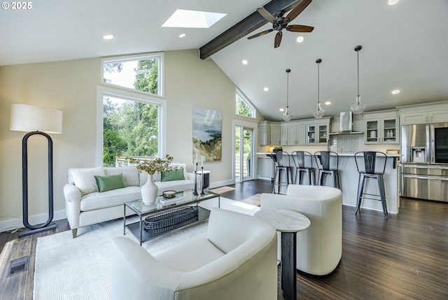 32518 Dillard Rd, Eugene, OR 97405 - living room featuring beamed ceiling, a skylight, recessed lighting, high vaulted ceiling, and dark wood-style floors