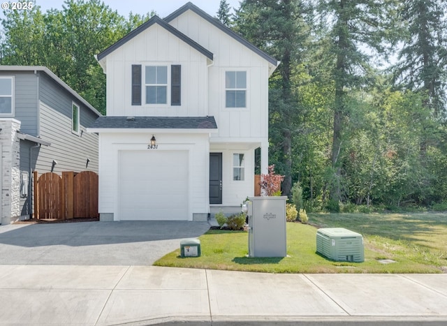 2431 SW 5th Pl, Battle Ground, WA 98604 - view of front of property featuring board and batten siding, a garage, and concrete driveway