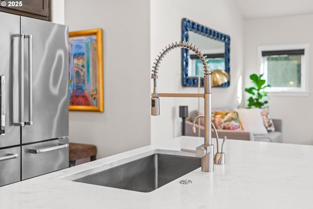 kitchen featuring sink and high end refrigerator