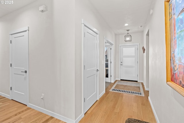 hallway featuring light wood-type flooring