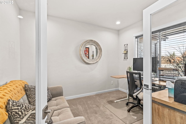 office area with light colored carpet