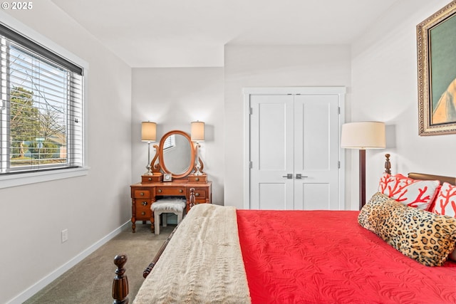 bedroom featuring a closet and carpet flooring