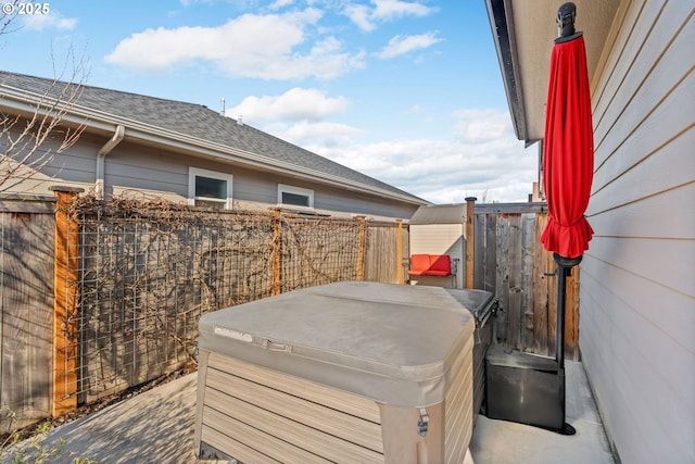 view of patio with a hot tub