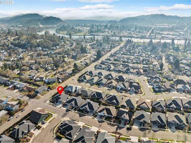 birds eye view of property with a mountain view