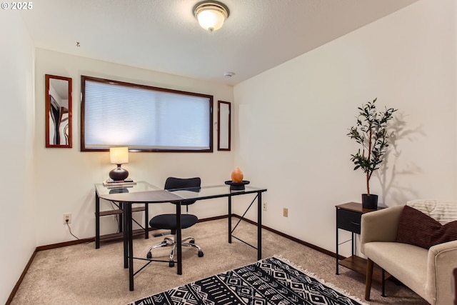 home office featuring carpet flooring and baseboards