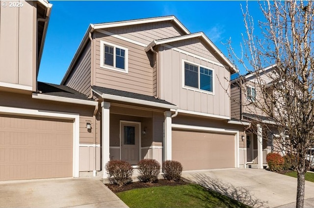 craftsman-style house featuring a garage, driveway, and board and batten siding