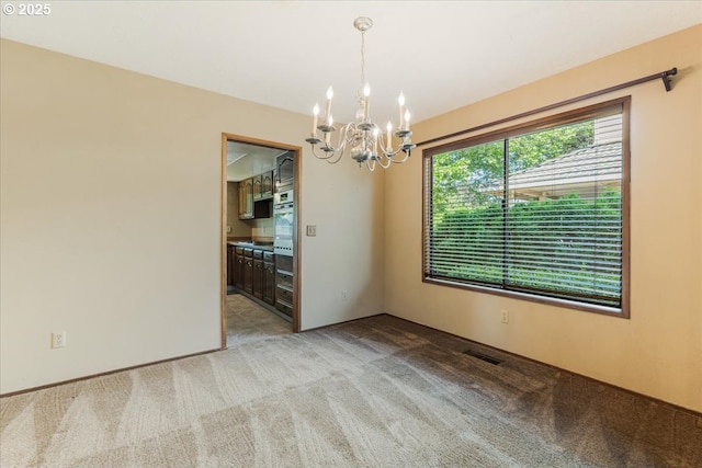 324 N Peacock Ct, Newberg, OR 97132 - unfurnished room with a chandelier and light colored carpet