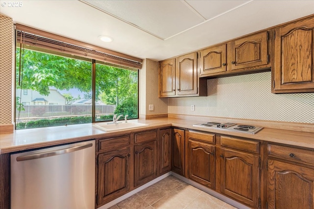 324 N Peacock Ct, Newberg, OR 97132 - kitchen with dishwasher, electric cooktop, light countertops, and tasteful backsplash