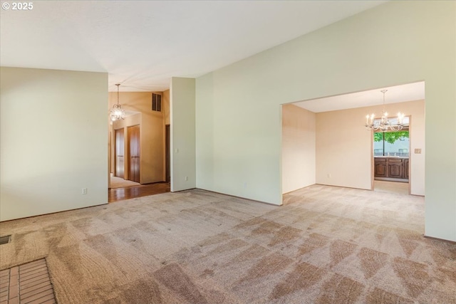 324 N Peacock Ct, Newberg, OR 97132 - spare room featuring a chandelier and carpet
