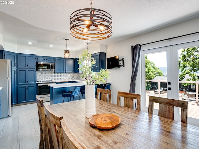 5210 N Emerson Dr, Portland, OR 97217 - dining room featuring a chandelier and recessed lighting