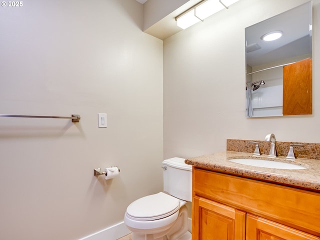 5210 N Emerson Dr, Portland, OR 97217 - bathroom with toilet, vanity, and baseboards