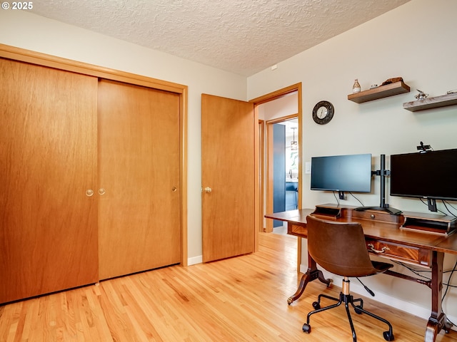 5210 N Emerson Dr, Portland, OR 97217 - office space with wood finished floors, a textured ceiling, and baseboards