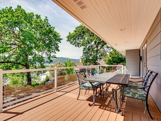 5210 N Emerson Dr, Portland, OR 97217 - wooden deck featuring outdoor dining area and a mountain view