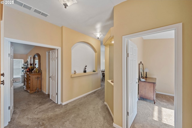 hallway with light carpet