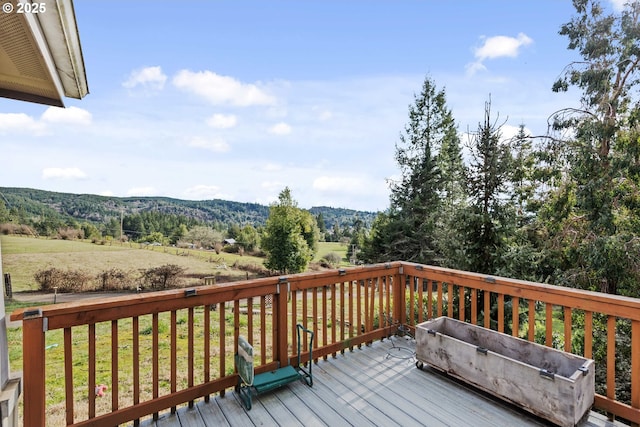 wooden deck with a rural view