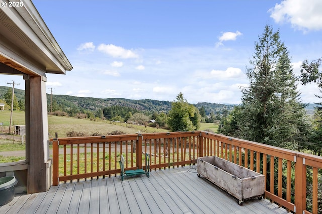 wooden terrace with a mountain view