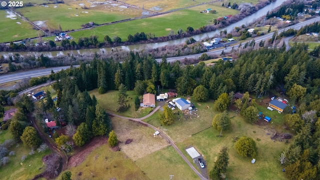 birds eye view of property with a rural view