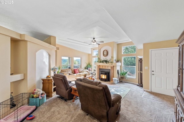 living room featuring vaulted ceiling, light carpet, and ceiling fan