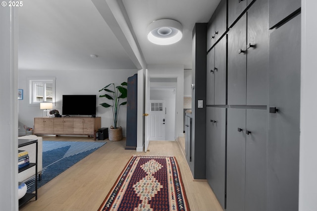 hallway with light wood-style floors