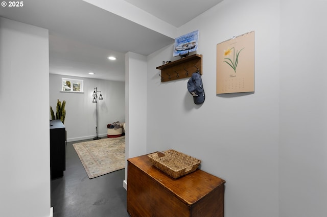 corridor with recessed lighting and finished concrete flooring