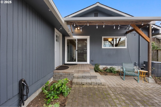 property entrance with a patio area and central AC