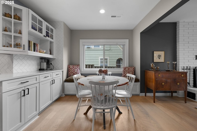 dining space featuring recessed lighting, light wood-style floors, and visible vents