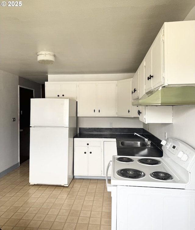2440 Pine St, Seaside, OR 97138 - kitchen featuring white appliances, a sink, under cabinet range hood, and white cabinets