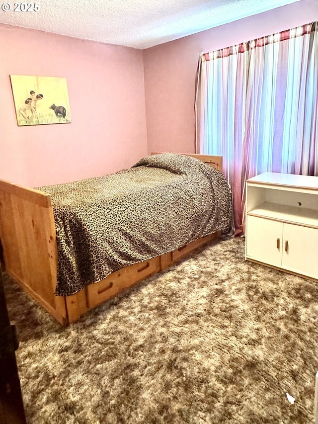 2440 Pine St, Seaside, OR 97138 - carpeted bedroom with a textured ceiling