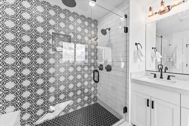 bathroom featuring vanity and a stall shower