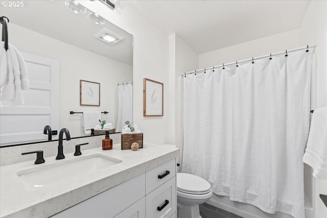 bathroom with shower / bath combination with curtain, tile patterned flooring, vanity, and toilet