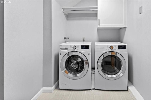 laundry room with cabinet space, independent washer and dryer, and baseboards