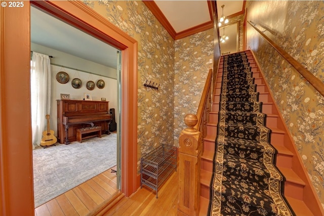 369 37th St, Astoria, OR 97103 - corridor featuring ornamental molding, hardwood / wood-style floors, plenty of natural light, french doors, and wallpapered walls