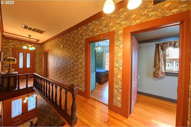 369 37th St, Astoria, OR 97103 - bedroom with wood finished floors, a textured wall, and baseboards