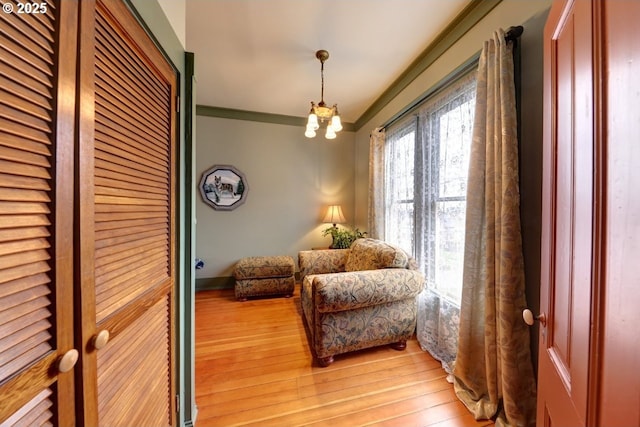 369 37th St, Astoria, OR 97103 - hallway with light wood-style flooring, ornamental molding, and healthy amount of natural light