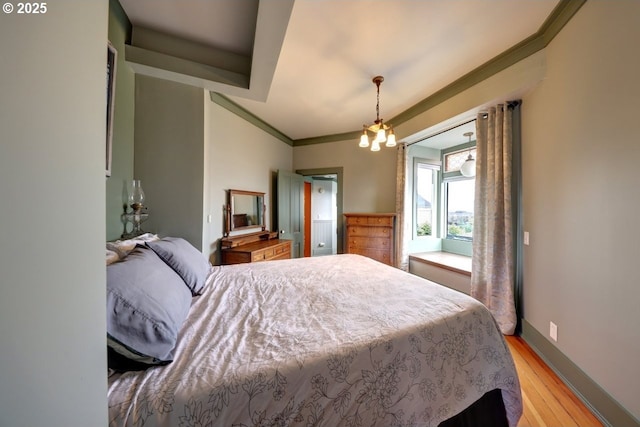 369 37th St, Astoria, OR 97103 - bedroom featuring crown molding, wood finished floors, and baseboards