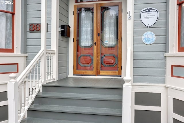 369 37th St, Astoria, OR 97103 - corridor with wallpapered walls, wood finished floors, and ornamental molding