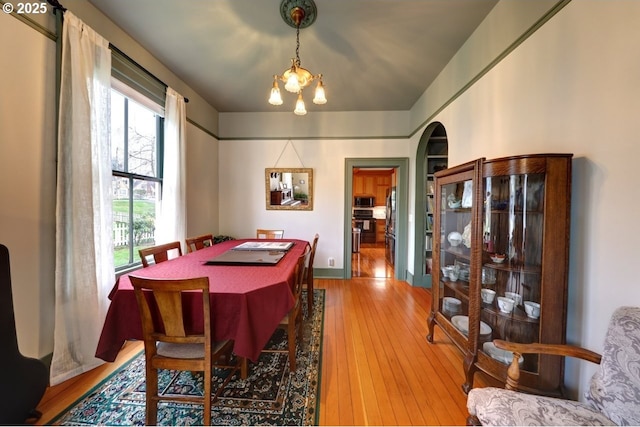 369 37th St, Astoria, OR 97103 - dining space with a chandelier and hardwood / wood-style floors