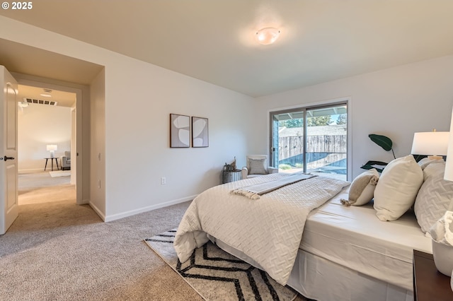 bedroom featuring light carpet and access to outside