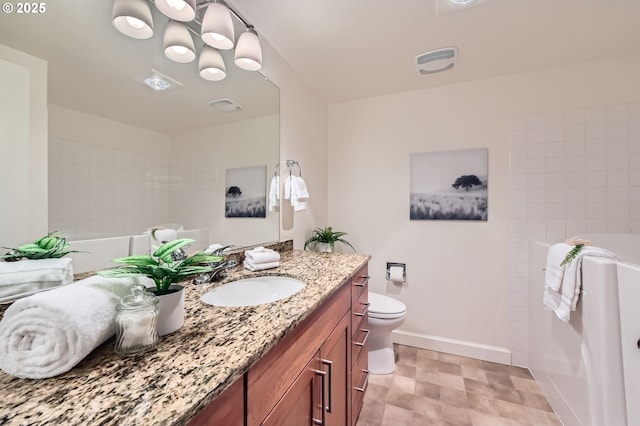 bathroom with vanity and toilet