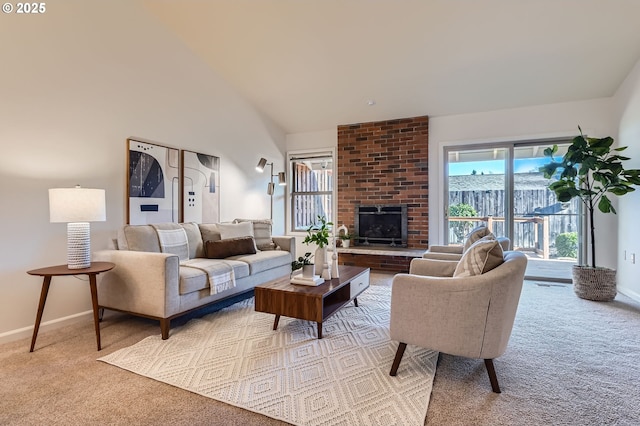 carpeted living room featuring a brick fireplace and a towering ceiling