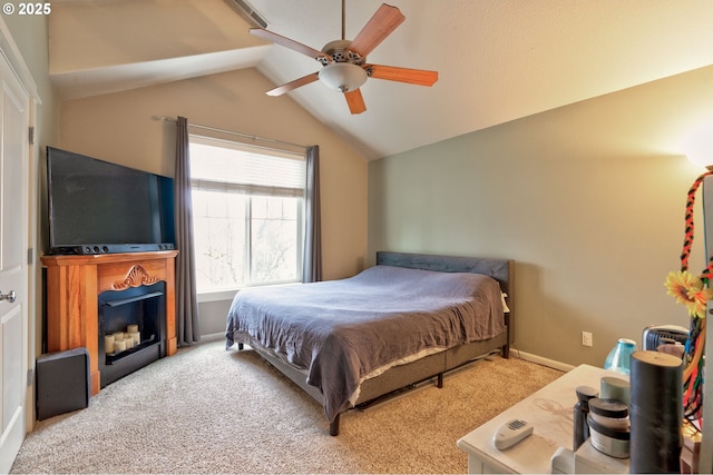 carpeted bedroom with lofted ceiling and ceiling fan