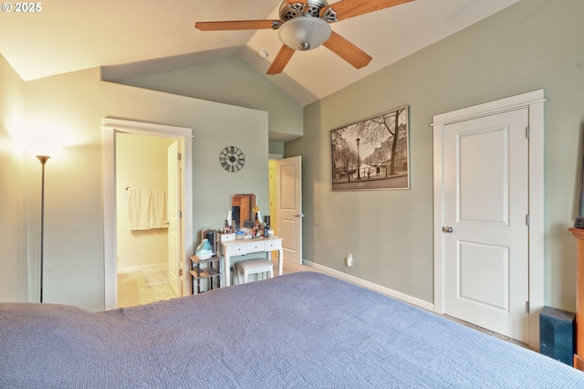 bedroom featuring lofted ceiling, ensuite bath, and ceiling fan